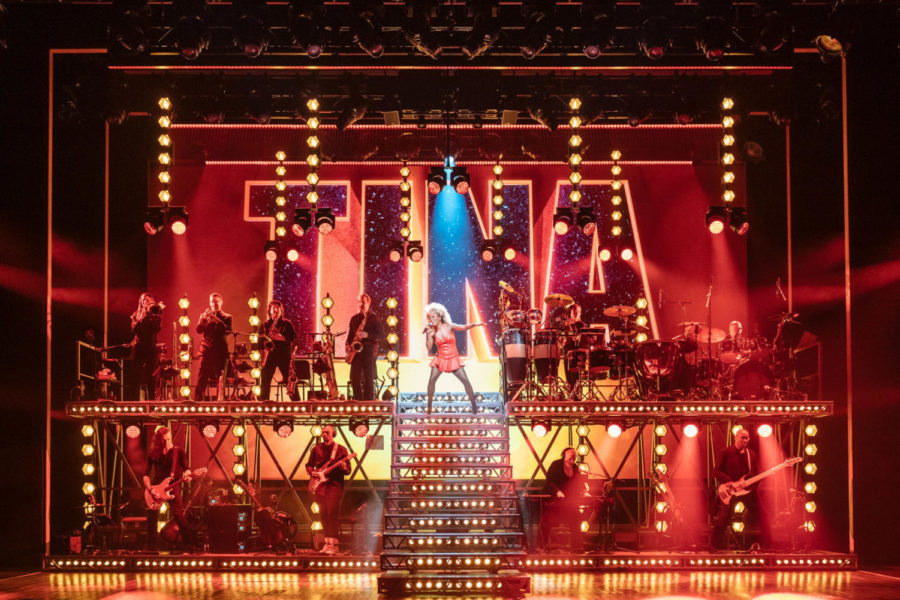Adrienne Warren, center, stars in Tina: The Tina Turner Musical.